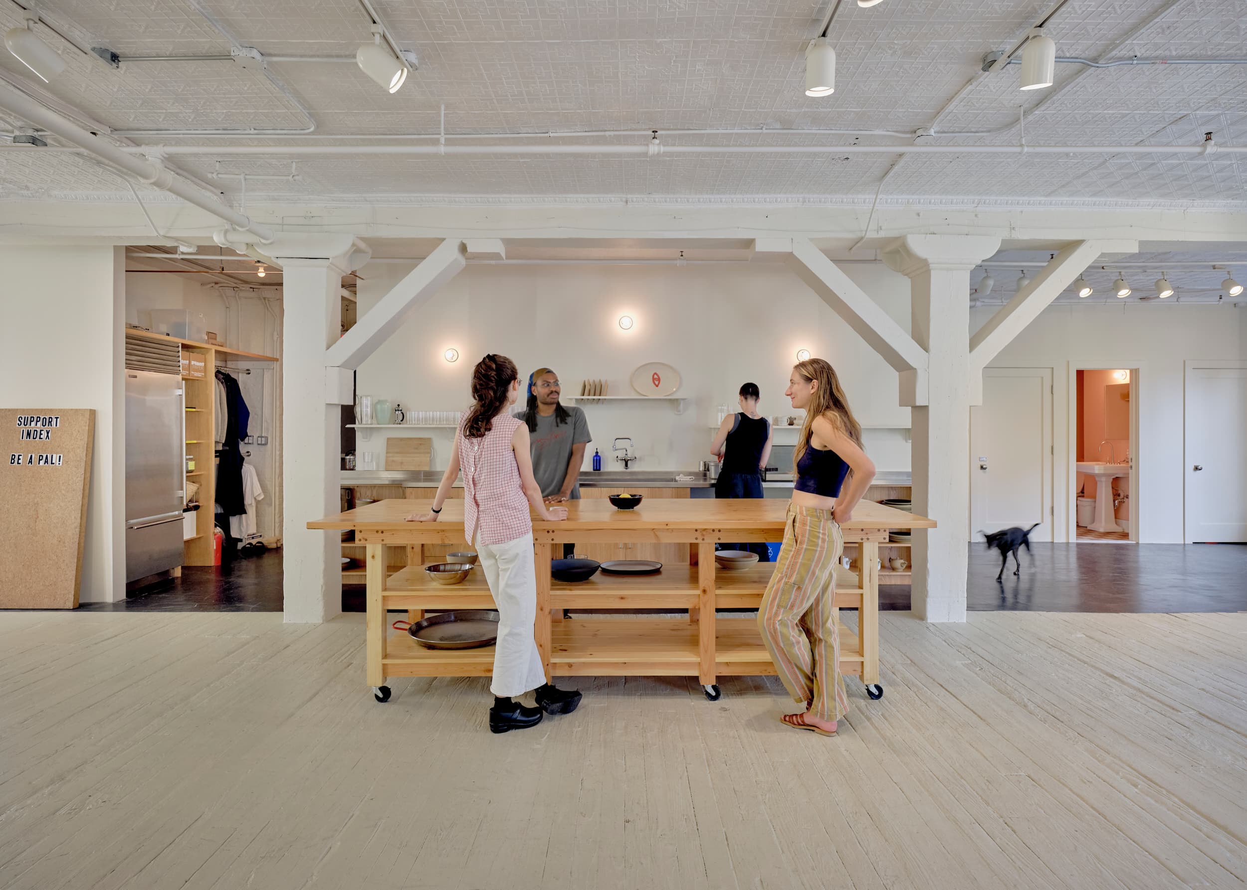 People enjoying conversation around the island in the Index kitchen